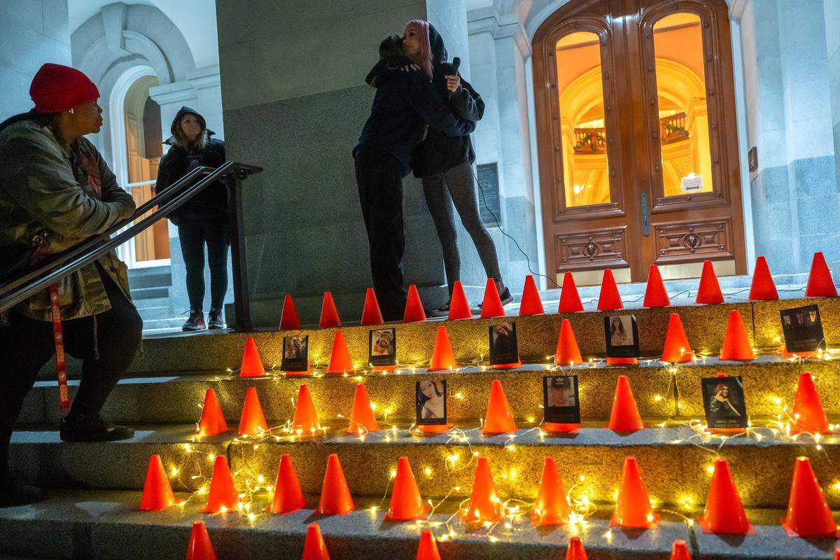 Erika Pringle, right, hugs Allison Lyman at a local vigil she organized Sunday at the state Capitol to mark the World Day of Remembrance for Road Traffic Victims. Lyman’s son Conor Lopez, 23, died after a car turned into his path while he was riding his motorcycle in Elk Grove. He died in April – two years to the day after Erika Pringle’s brother was killed by a woman who ran a red light in Rosemont. Pringle organized the vigil for other traffic victims.