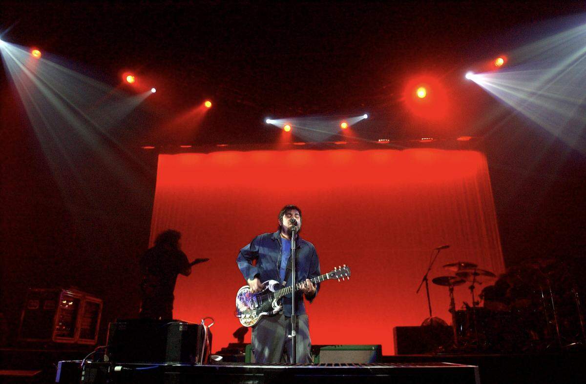 Deftones lead singer Chino Moreno plays the guiter during the opening song of their concert at Memorial Auditorium on Jan. 21, 2004.