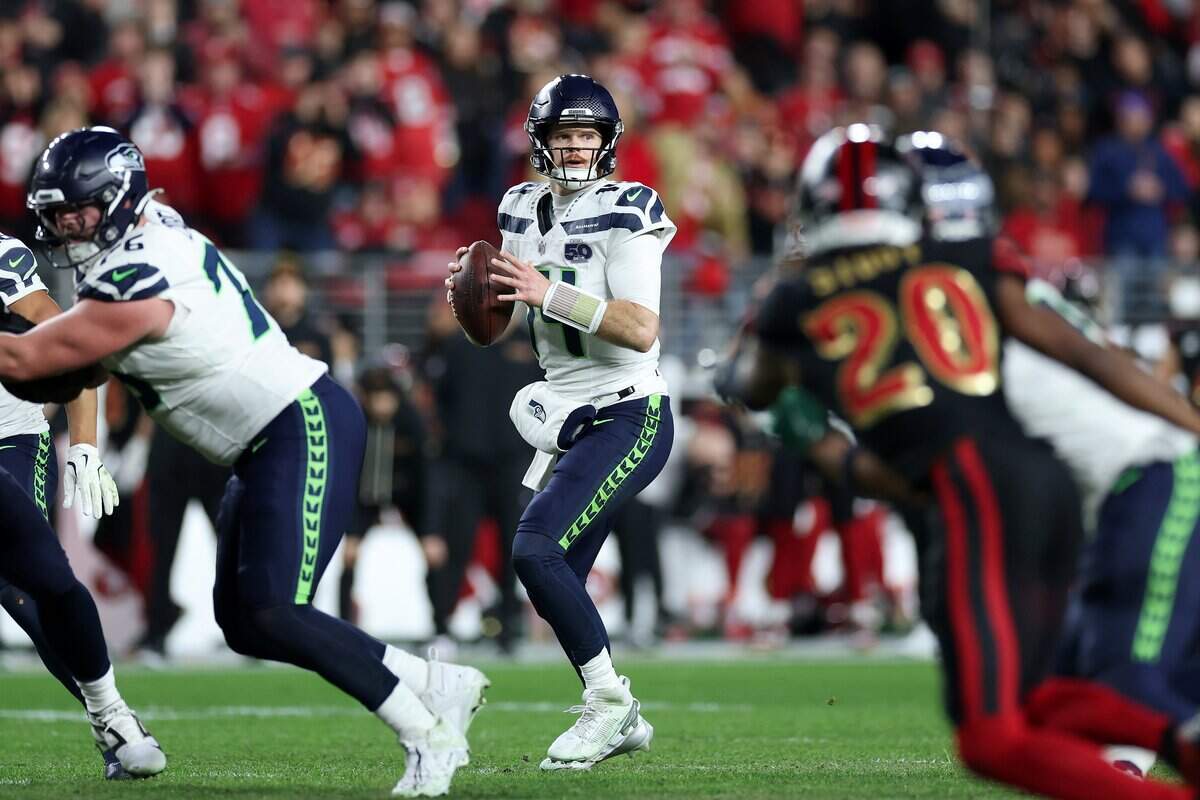 Quarterback Sam Darnold of the Seattle Seahawks looks to pass during the game between Seahawks and San Francisco 49ers at Levi's Stadium on Jan. 3 in Santa Clara. Darnold hurt his oblique during practice Thursday and reportedly hasn’t thrown the ball since then ahead of Saturday’s divisional round playoff game against the 49ers.