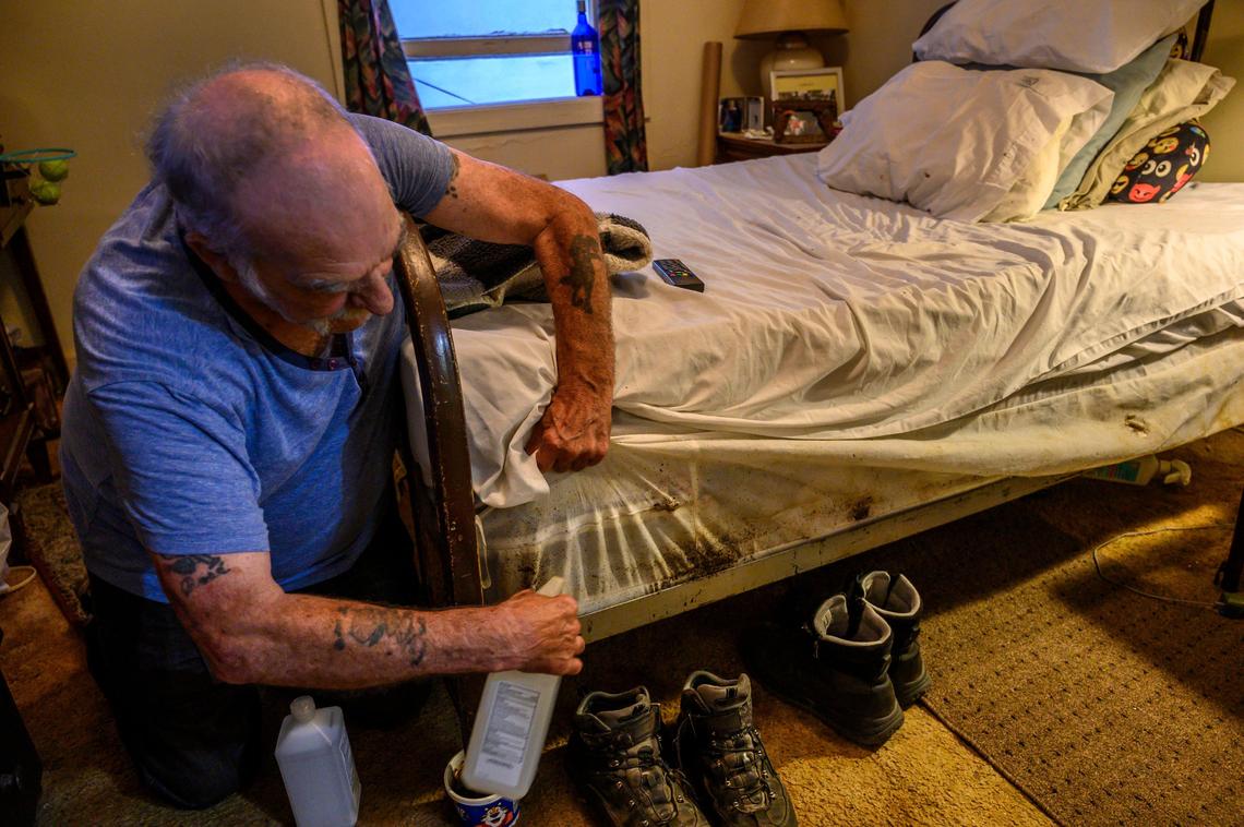 Jimmy Garlin, 72, sprays for bedbugs that have infested his bed at the Capitol Park Hotel on Thursday, Aug. 29, 2019 in Sacramento. “It’s like an invasion. Its very difficult. I have to spray myself and the sheets with alcohol to get any kind of rest,” he said. There was blood on his pillow from the bugs biting him in his sleep.