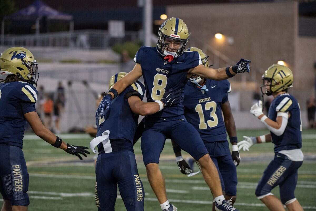 The West Park Bulldogs’ Deacon Ogden (8) celebrates with Gavin McDaniel (1) after scoring a touchdown against the Vacaville Bulldogs on Friday. No. 16 West Park will play No. 9 Roseville on Friday.