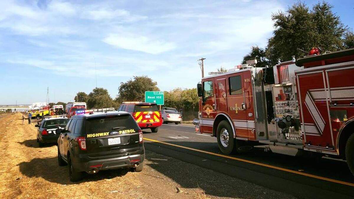 California Highway Patrol and fire personnel from Woodland at the scene of a fatal accident Thursday on southbound Interstate 5 just north of County Road 102.
