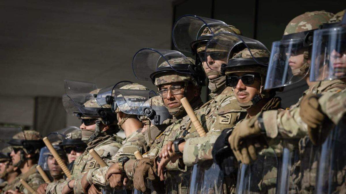 Federal officers and the National Guard protect the Federal building in downtown Los Angeles due to unrest from immigration raids in L.A. on Tuesday, June 10, 2025, in Los Angeles, California. (Jason Armond/Los Angeles Times/TNS)