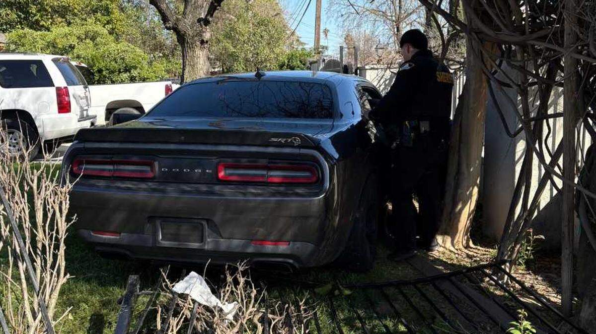 A Dodge on Tuesday afternoon March 11, 2025, was in a vehicle pursuit before the car crashed with another car and came to a stop in a home’s lawn near Martin Luther King Jr. Boulevard and 23rd Avenue in Sacramento.