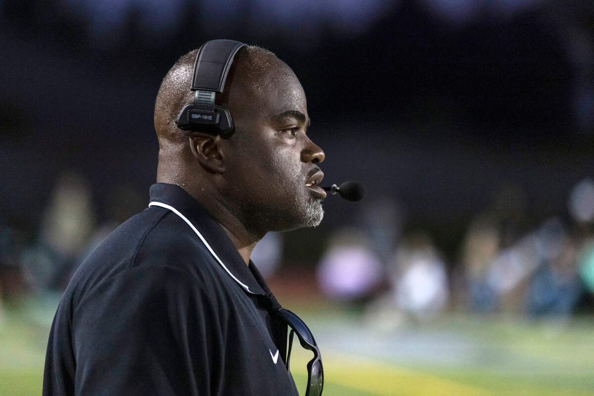 Jesuit coach Marlon Blanton watches from the sidelines during the game at Granite Bay High School in September. Jesuit won 28-14.
