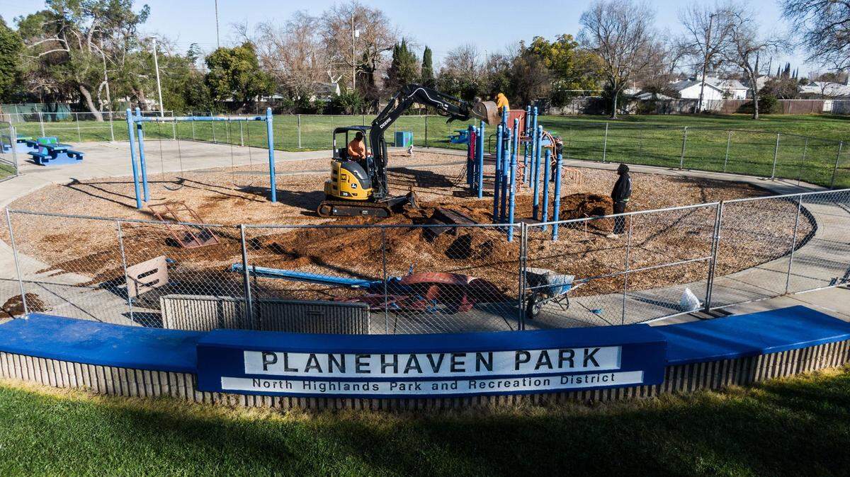 Workers demolish a play structure at Planehaven Park in North Highlands on Monday, Feb. 10. A new playground will be built at the site with federal funding secured by the park district.