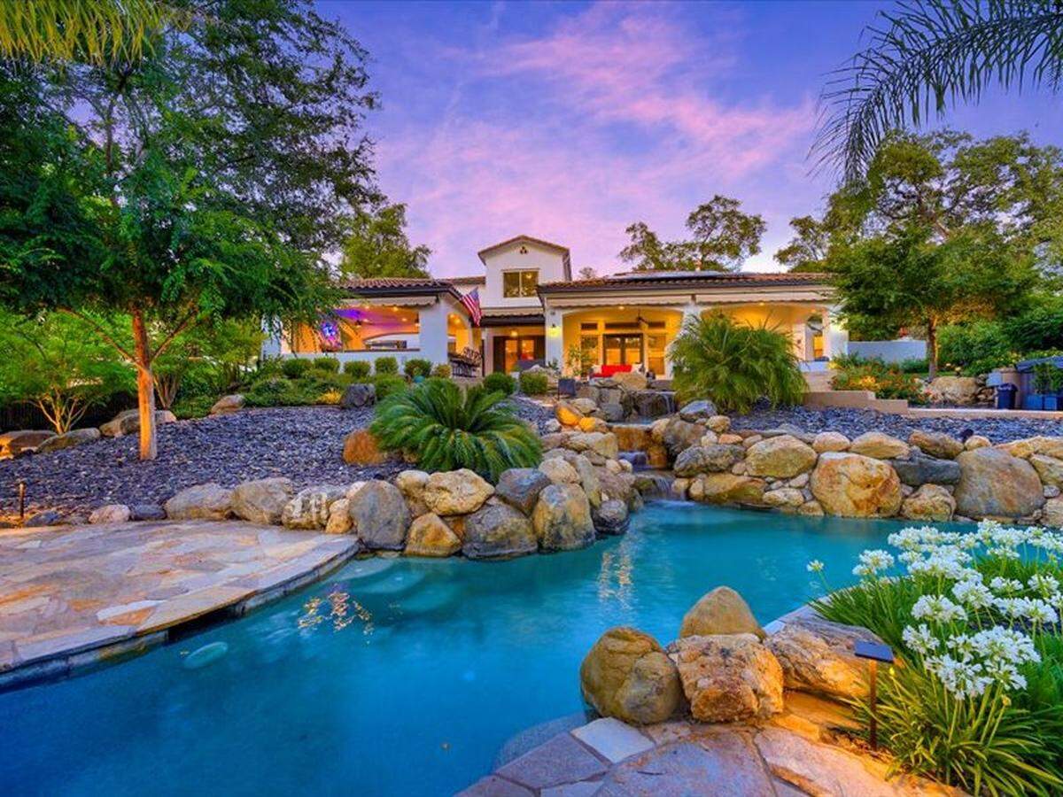The Lincoln home in the golf community of Catta Verdera has a lazy river-style pool and resort living backyard.