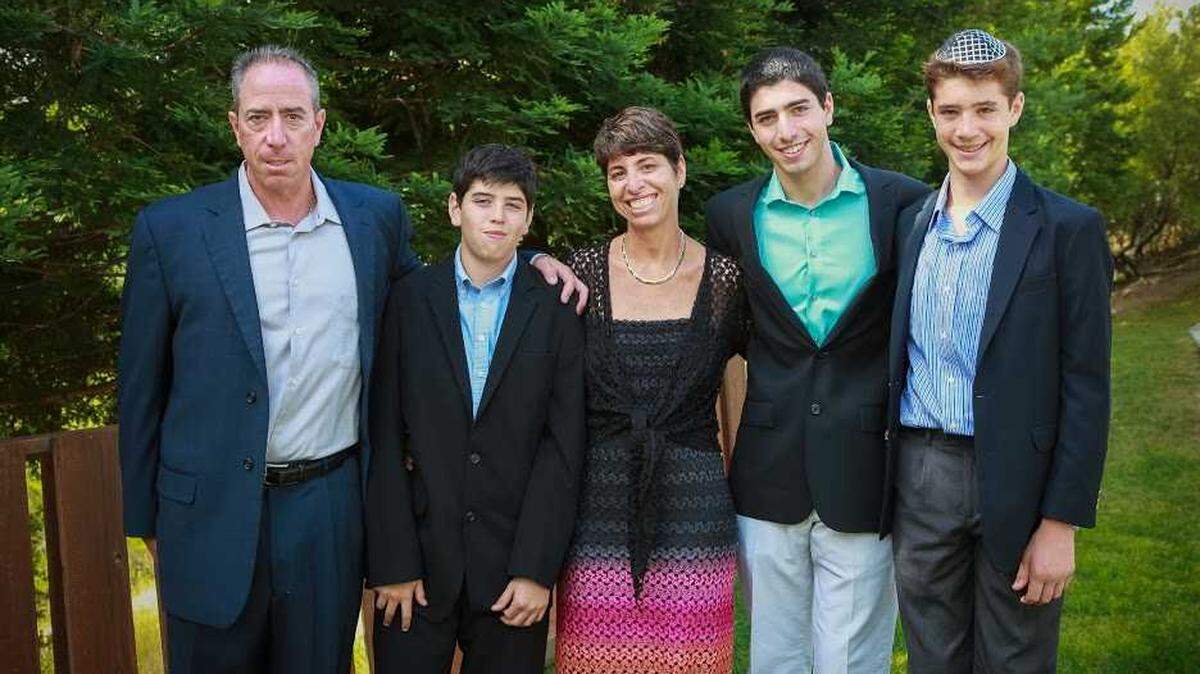 Liron Petrushka, left, and his wife, Naomi, center, pose for a photo with their sons. The couple died Saturday when their plane crashed after trying to land at Truckee Tahoe Airport.
