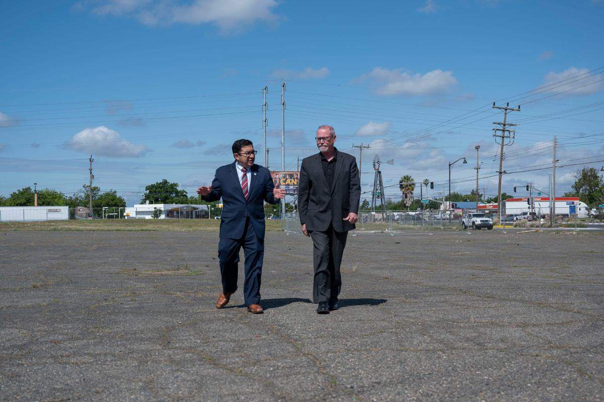 Sacramento Councilman Eric Guerra, left, talks with county Supervisor Patrick Kennedy on April 20, as they walk on the proposed site of “Safe Stay Community” on Florin Road and Power Inn. “Homelessness is the biggest crises facing our community,” said Kennedy.