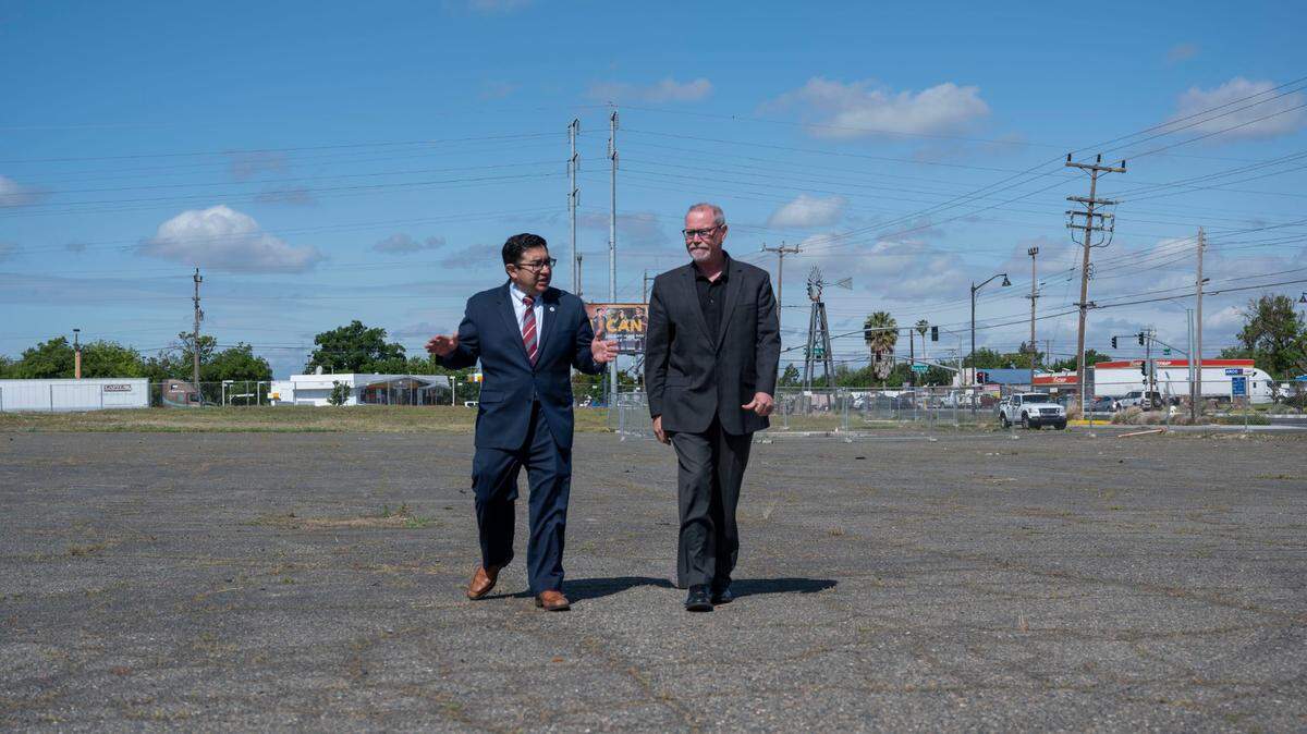 Sacramento Councilman Eric Guerra talks with county Supervisor Patrick Kennedy on Wednesday, April 20, 2022, as they walk on the proposed site of “Safe Stay Community” on Florin Road and Power Inn. “Homelessness is the biggest crises facing our community,” said Kennedy.