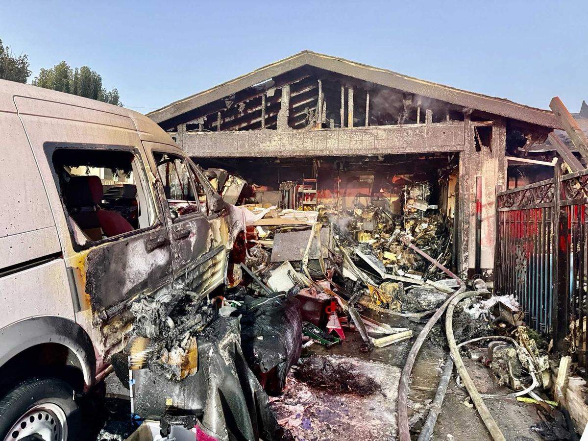 The garage of a home on the 8500 block of Fairlawn Court in south Sacramento is heavily damaged after a fire on Tuesday, Aug. 19, 2025. Sacramento Metro Fire officials say flames were fully involved in the garage when crews arrived shortly after 5 a.m. and had begun spreading into the house.