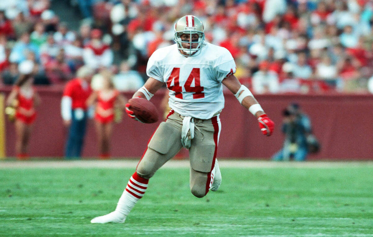 San Francisco 49ers fullback Tom Rathman carries the ball against the Denver Broncos on Aug. 19, 1989, at Candlestick Park.