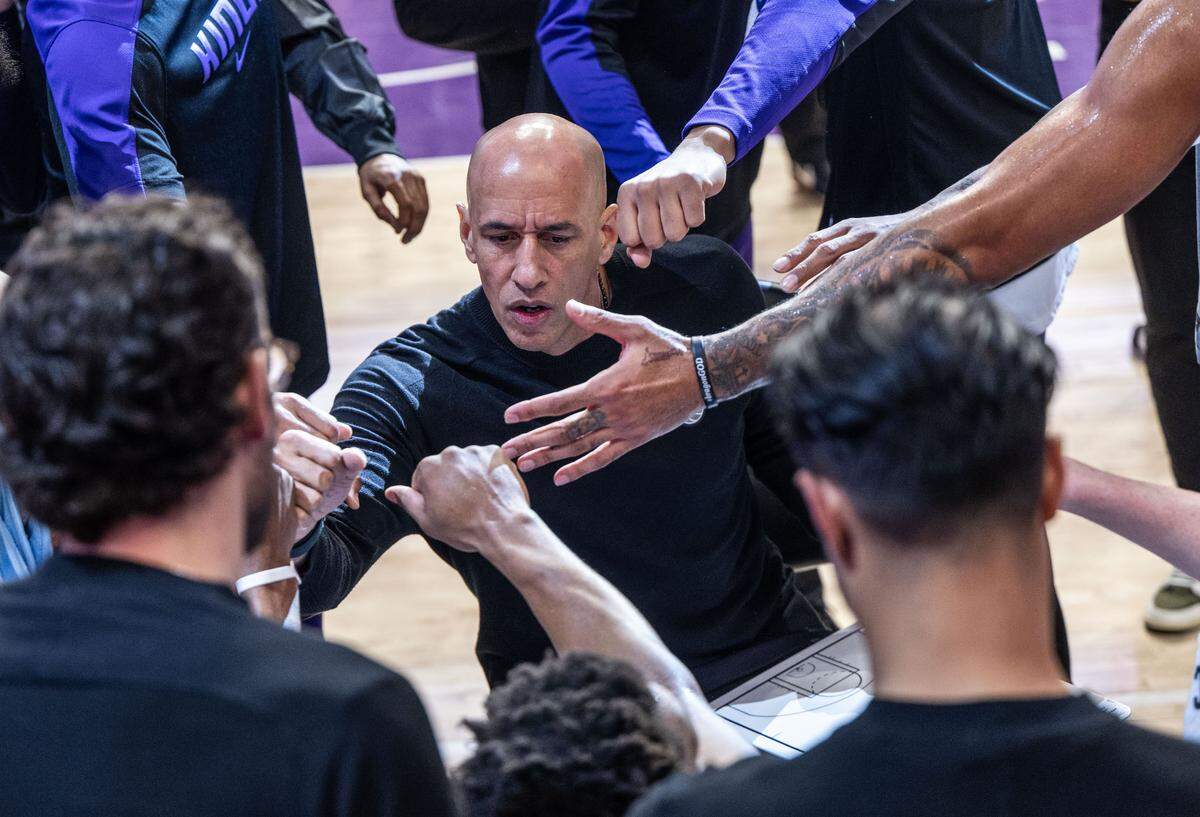 Sacramento Kings interim coach Doug Christie speaks to his players during a timeout against the Dallas Mavericks on Monday, Dec. 30, 2024, during his first game at Golden 1 Center in that role.