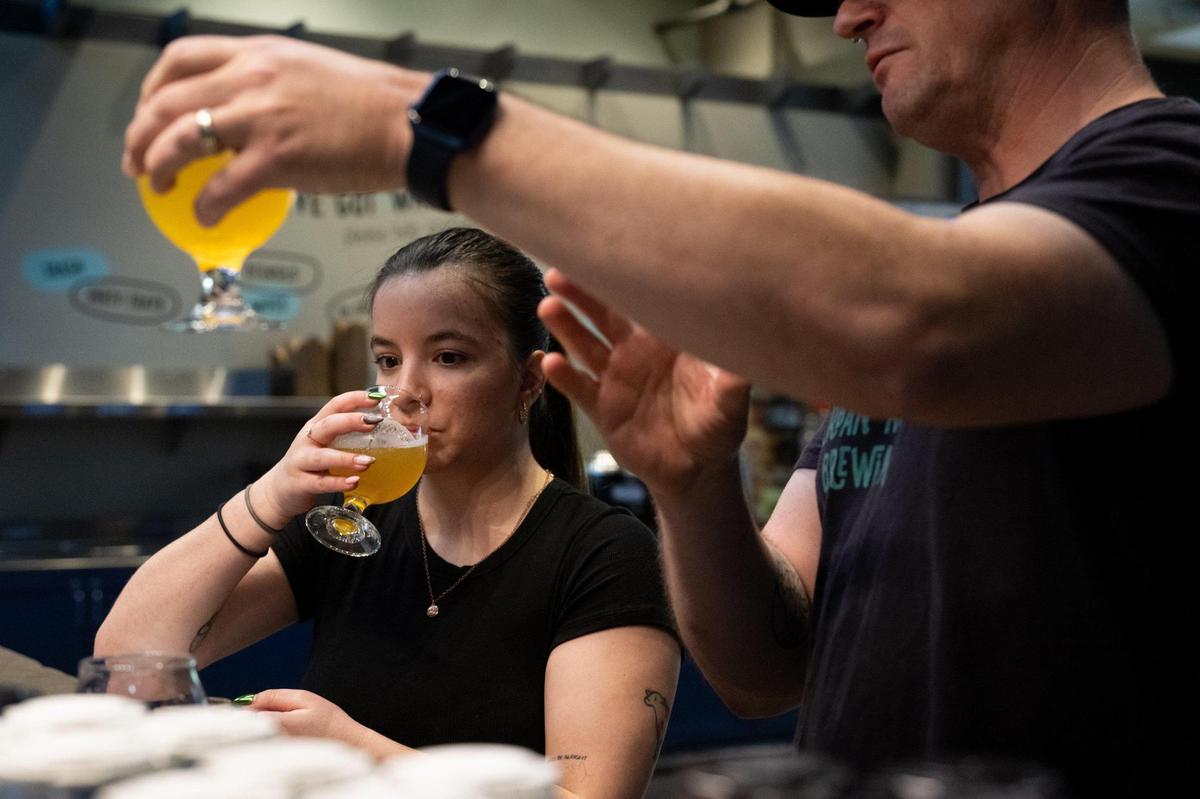 Urban Roots brewer Peter Hoey explains the nuances of beer to Sacramento Bee food writer Camila Pedrosa on Monday, April 14, 2025, at the Sacramento brewery.