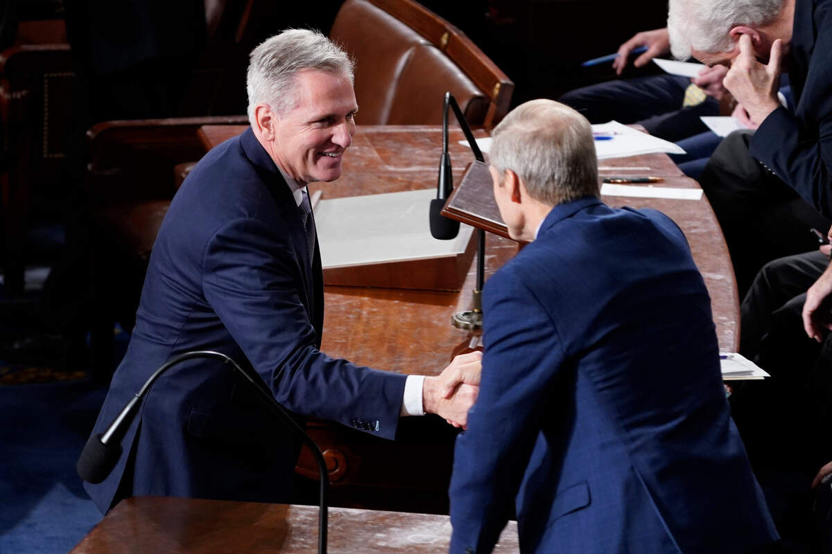 Former Speaker of the House Rep. Kevin McCarthy, R-Calif., shakes hands with Rep. Jim Jordan, R-Ohio, after nominating Jordan at the start of a third speaker vote on the House floor in Washington on Friday. Jordan failed to earn the votes needed to become speaker on the third try.