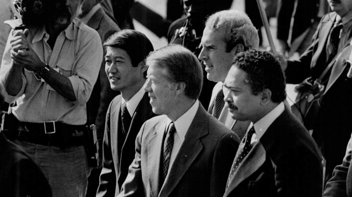 President Jimmy Carter walks to rally in K Street Mall on Nov. 4, 1978, with congressional hopefuls Robert Matsui, left, and Vic Fazio, behind Matsui. Mervyn Dymally, right, is incumbent candidate for lieutenant governor.