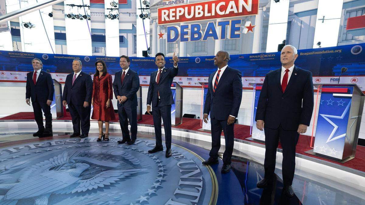 GOP presidential candidates, from left, Doug Burgum, Chris Christie, Nikki Haley, Ron DeSantis, Vivek Ramaswamy, Tim Scott and Mike Pence meet the crowd before the start of the second GOP debate, at the Ronald Reagan Presidential Library in Simi Valley, California, on Sept. 27.