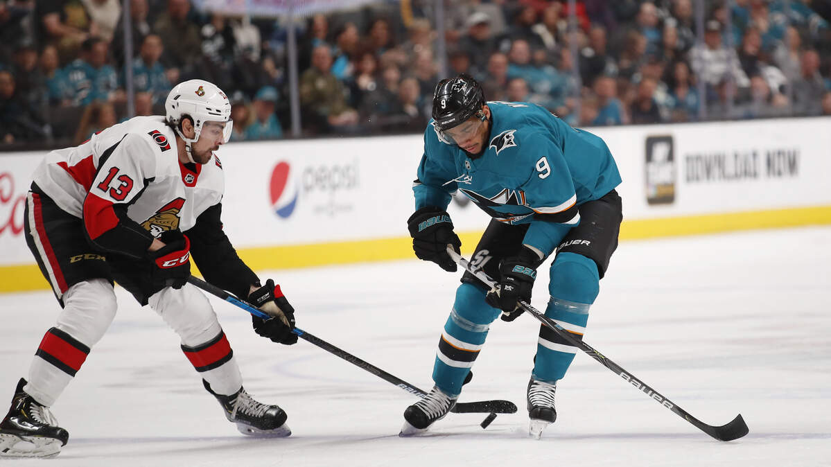 The San Jose Sharks' Evander Kane, right, and the Ottawa Senators Nick Paul battle for the puck Saturday in San Jose. It's unclear how the Sharks will proceed the next few weeks now that Santa Clara County has banned large gatherings. Fans won't be allowed into SAP Center for games.