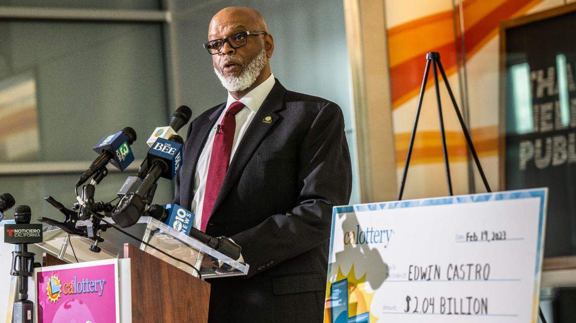 Alva Johnson, director of the California State Lottery, speaks during a Powerball prize ceremony in February. Johnson, who’s led the state agency since 2019, will leave his post Dec. 1, according to his resignation letter.