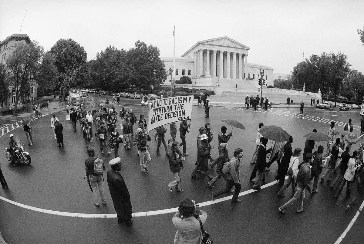 Demonstrators opposing the Allan Bakke “reverse discrimination” case pass the Supreme Court on Oct. 8, 1977.