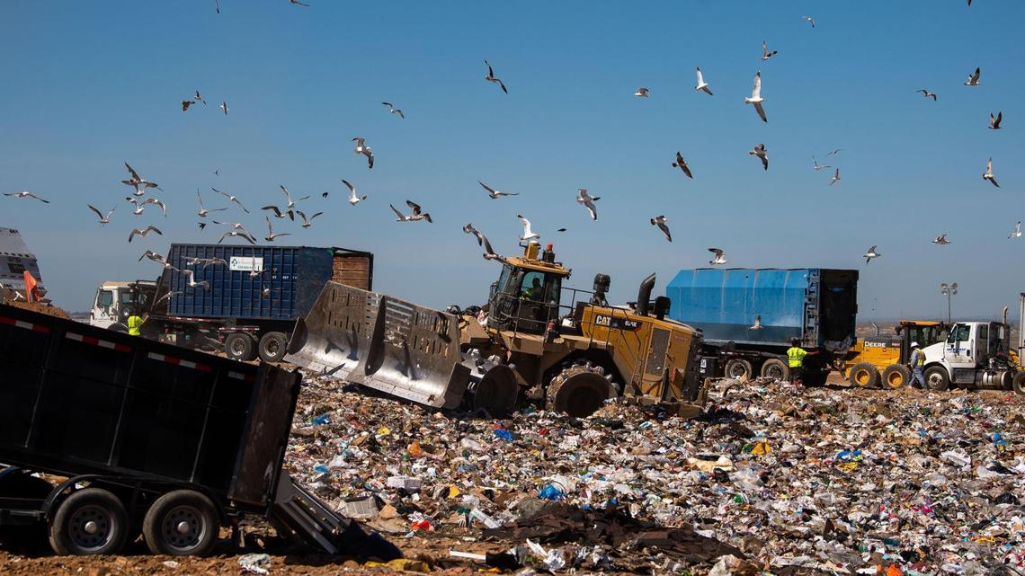 A bulldozer moves waste at Kiefer Landfill on Wednesday, April 7, 2021, in Sloughhouse. University of California still relies on fossil fuels, so to reach carbon neutral goals, it is instead trying to offset landfill emissions in other states.