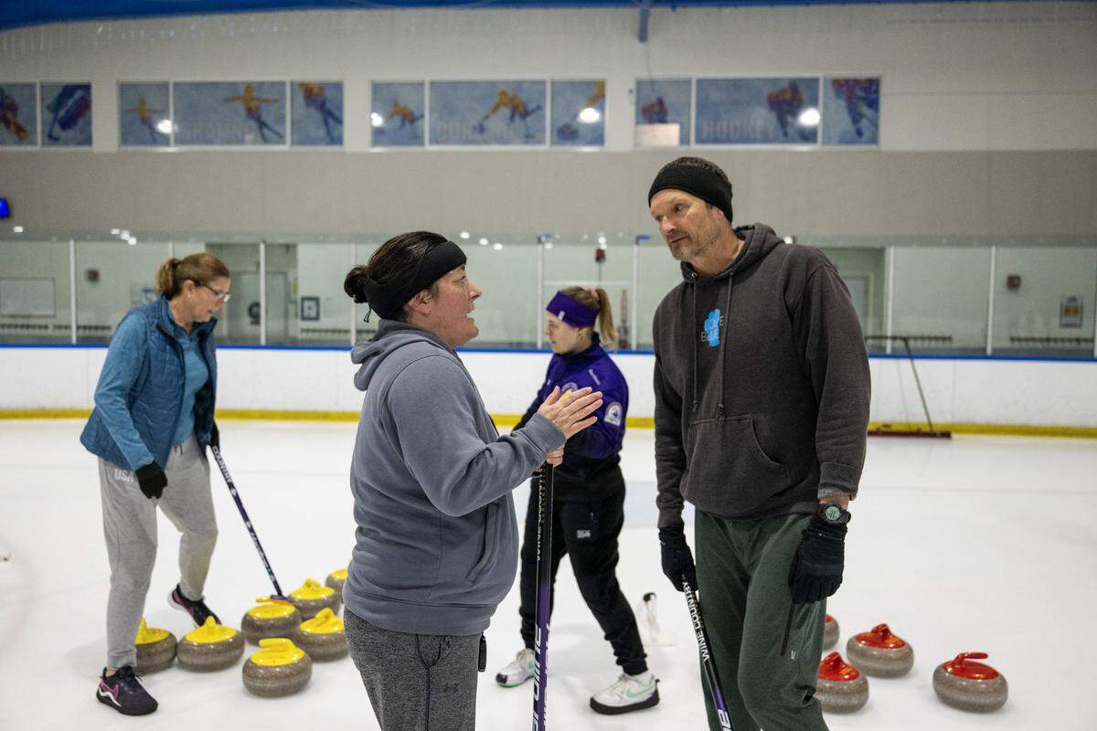 Melissa McGuire and Bill Grosser discuss strategy during a match earlier this month  at Skatetown Ice Arena in Roseville.