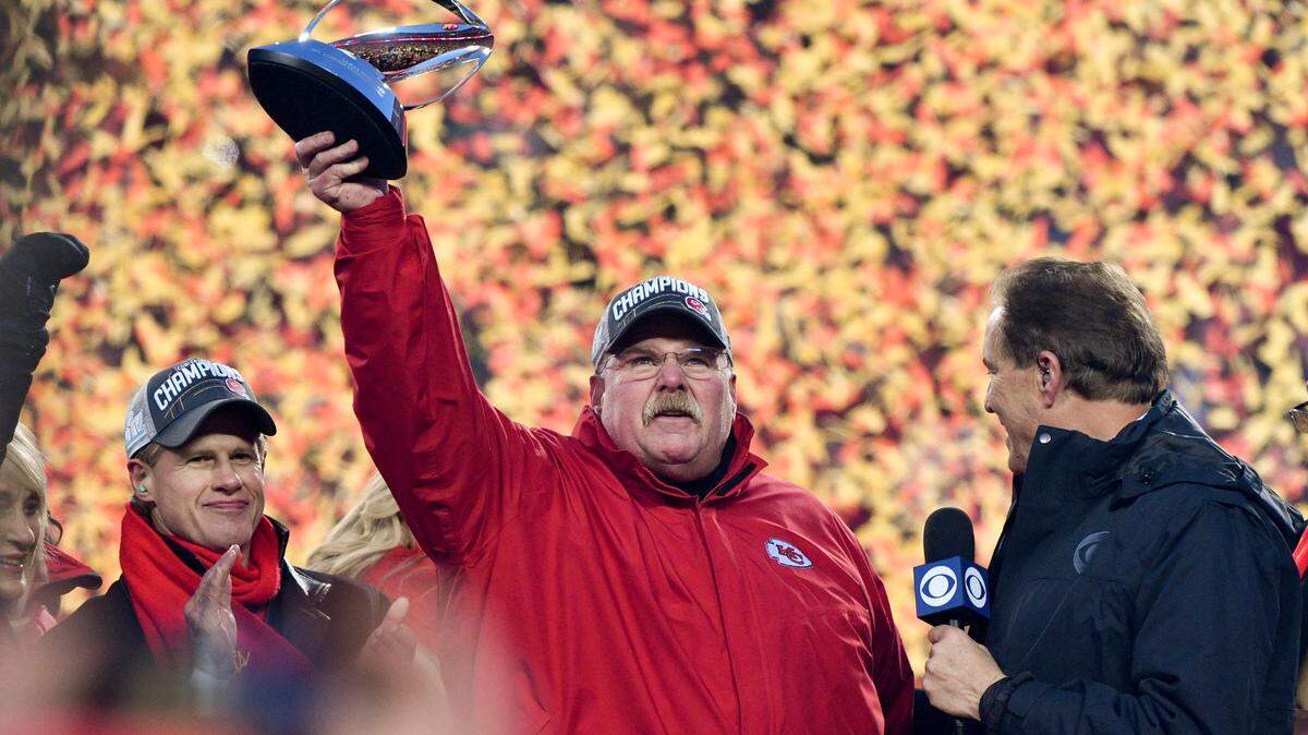 Kansas City coach Andy Reid holds the Lamar Hunt Trophy after the Chiefs beat the Titans 35-24 to win the AFC Championship game Sunday.