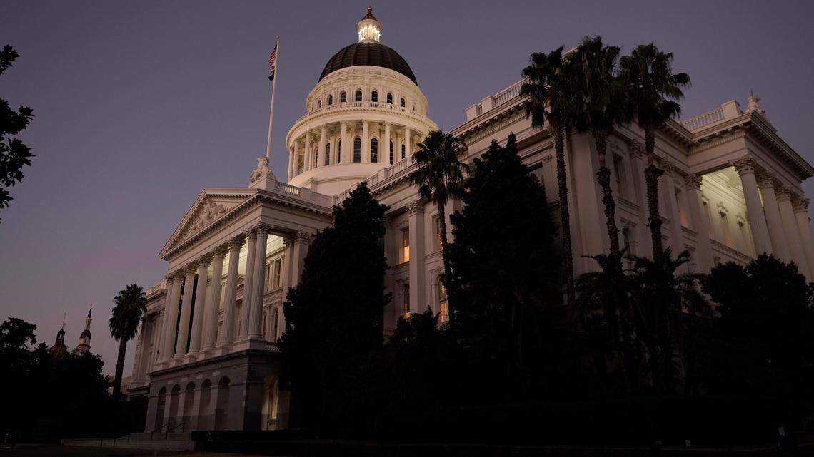 The lights of the state Capitol glow into the night in Sacramento, Calif., Wednesday, Aug. 31, 2022.