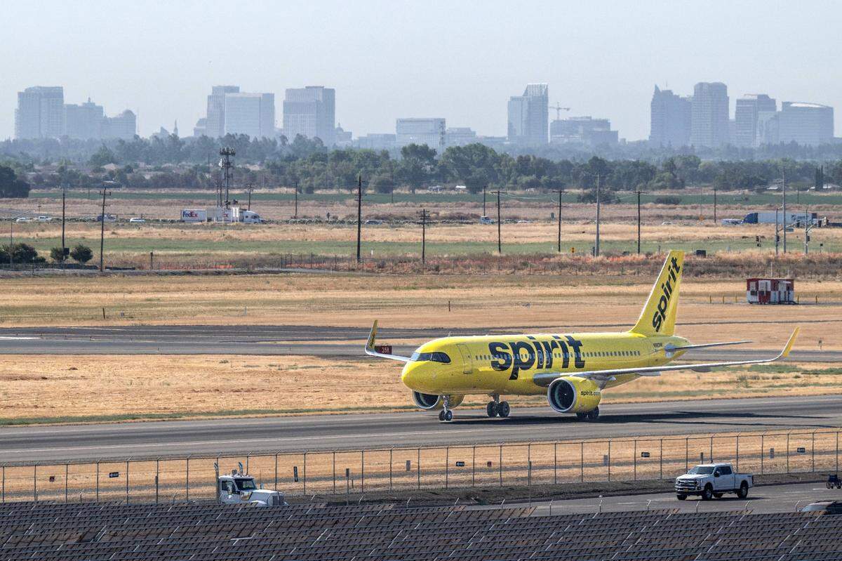 A Spirit Airlines flight makes its way to the concourse at Sacramento International Airport after landing following a global technology outage on Friday, July 19, 2024. The airline ceased operations on Saturday.
