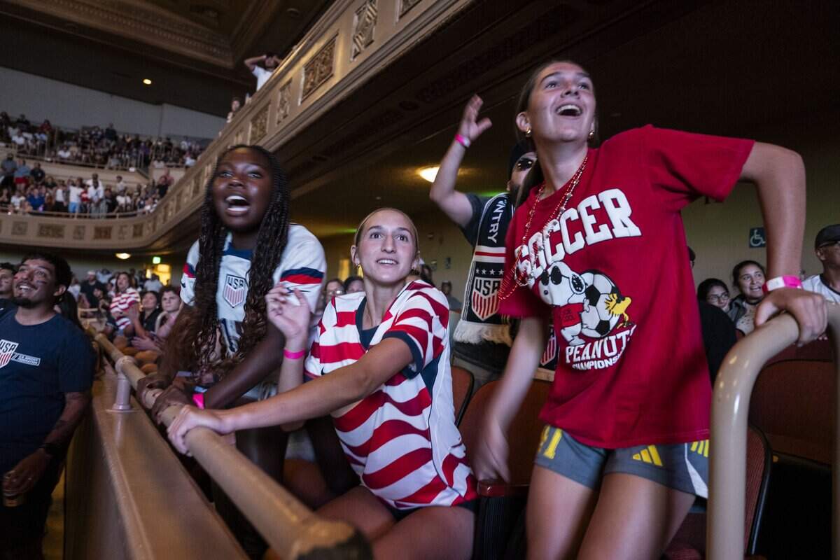 Lucy Hoffman, Keira Taylor and Evie Reid, all of Placer United Soccer Club, react to a play as they attend a watch party for the FIFA World Cup match between the United States and Belgium at Memorial Auditorium in Sacramento on Monday. The United States lost 4-1.