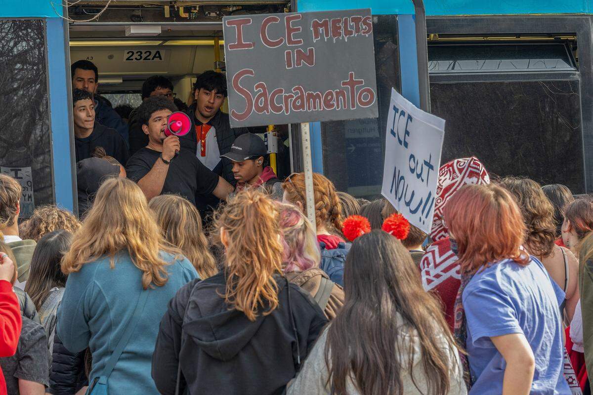 McClatchy High students are told to wait for the next light rail train during a districtwide walkout Friday, part of a nationwide effort to protest immigration enforcement following fatal shootings in Minneapolis.