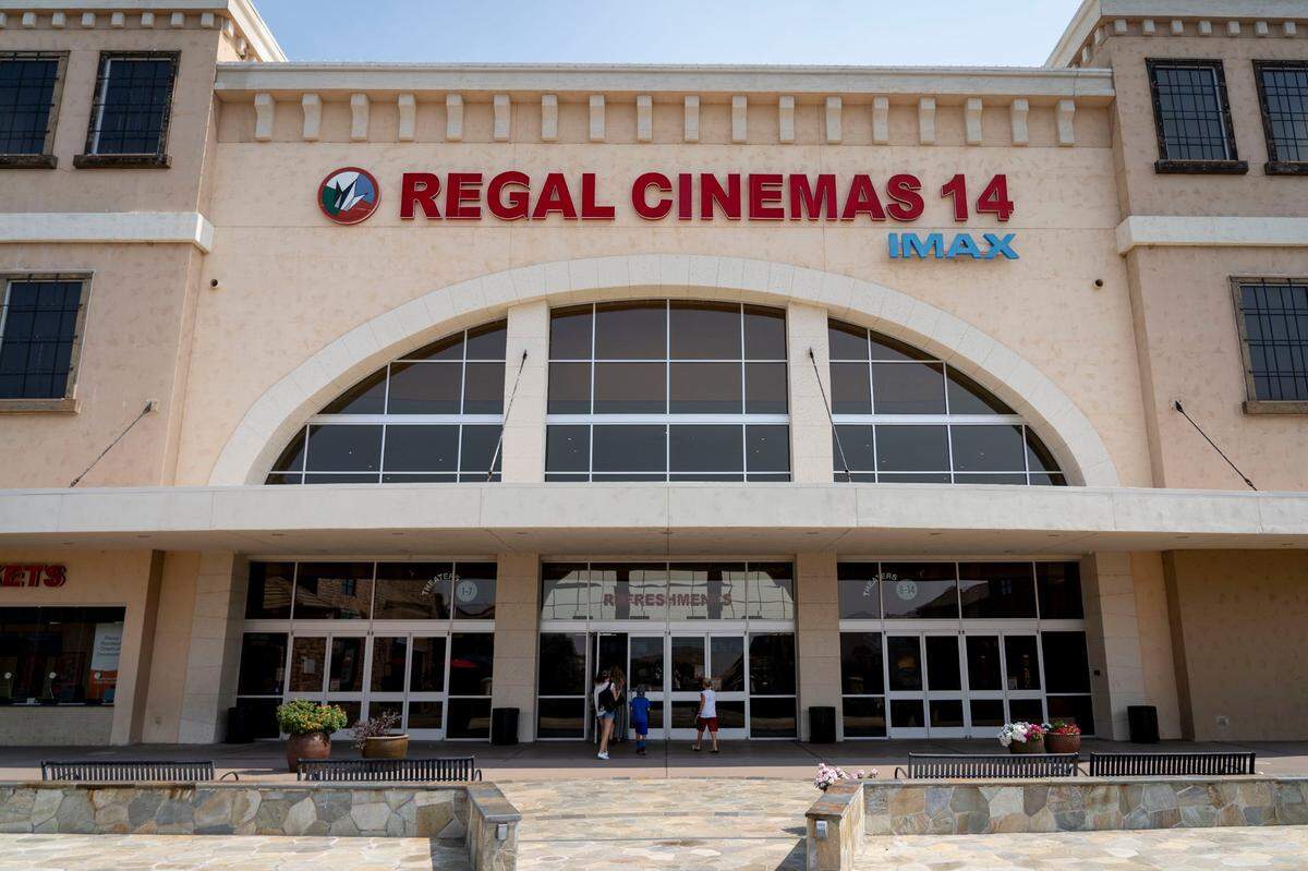 Movie goers enter the Regal Cinemas at El Dorado Hills Town Center in El Dorado Hills on Friday, Sept. 4, 2020, as some movie theaters open up to the public in California after being shuttered for months during the coronavirus pandemic.