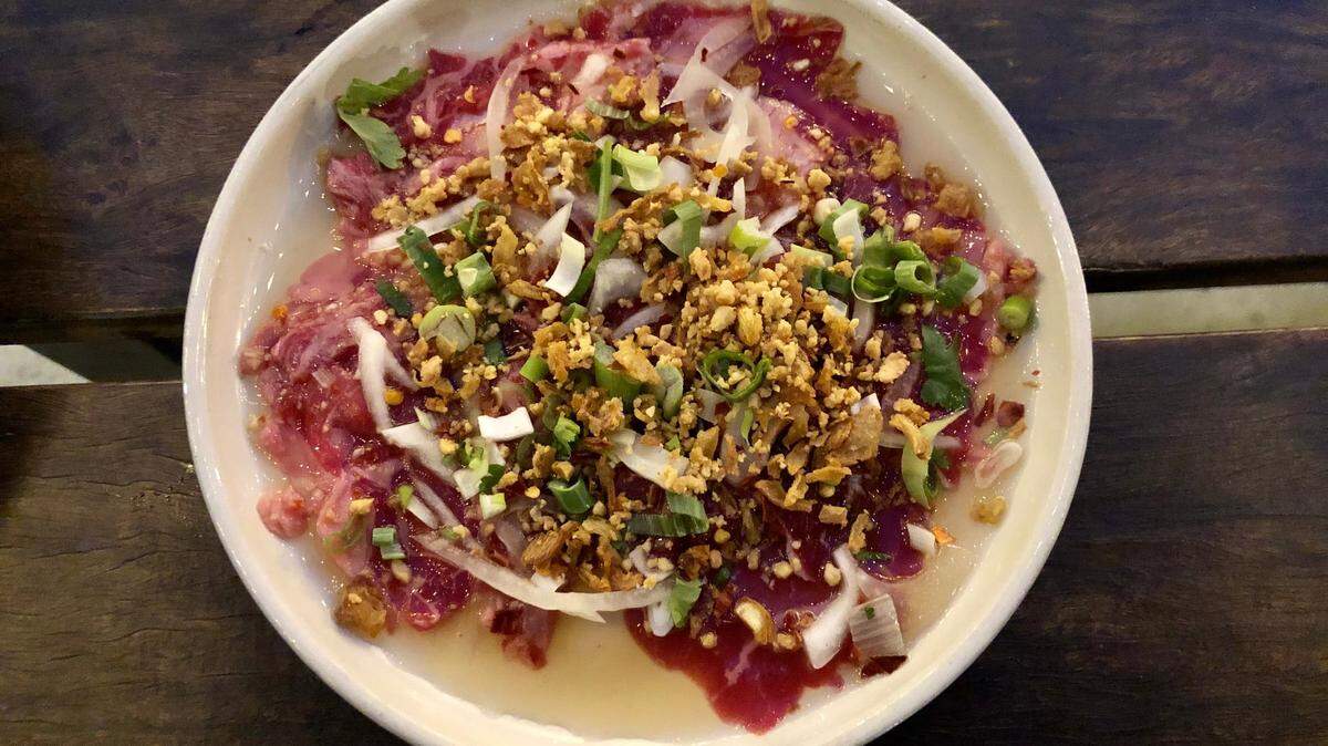Saigon Alley’s boi tai chanh soaks beef carpaccio in lime juice and tops it with shallots, onions, crushed peanuts and nuoc mam fish sauce.
