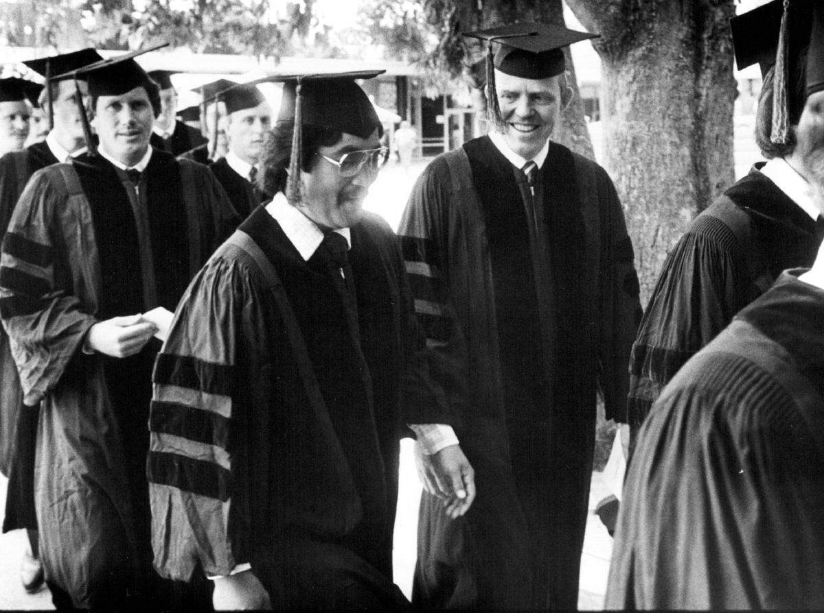 Allan Bakke, right center, joins fellow graduates of the UC Davis medical school after receiving their degrees on in 1982.