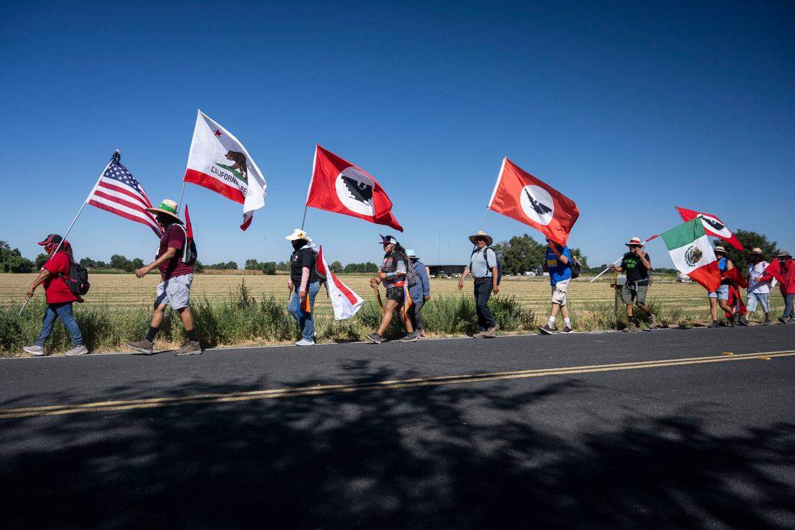 Supporters and members of the United Farm Workers union march in Galt on Tuesday on their way to Sacramento to ask for Gov. Gavin Newsom’s signature on AB 2183. The bill would let farm workers vote by mail to unionize. The 24-day, 335-mile march concludes Friday with a rally at the west steps of the Capitol.