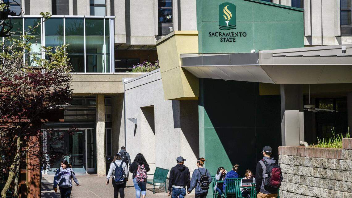 Sacramento State students make their way to the University Union while others use computer charging stations outside to do their schoolwork on Thursday, March 12, 2020. The school announced Thursday that all classes would be moved online for the rest of the semester in response to concerns about the coronavirus.