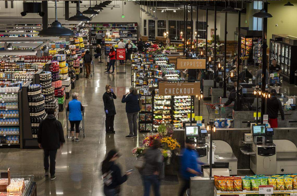 Customers shop at the opening of the new Raley’s in South Land Park in Sacramento on Wednesday, April 15, 2020. Because of COVID-19, the store didn’t hold a grand opening celebration but said it plans to celebrate with the community at a later date.