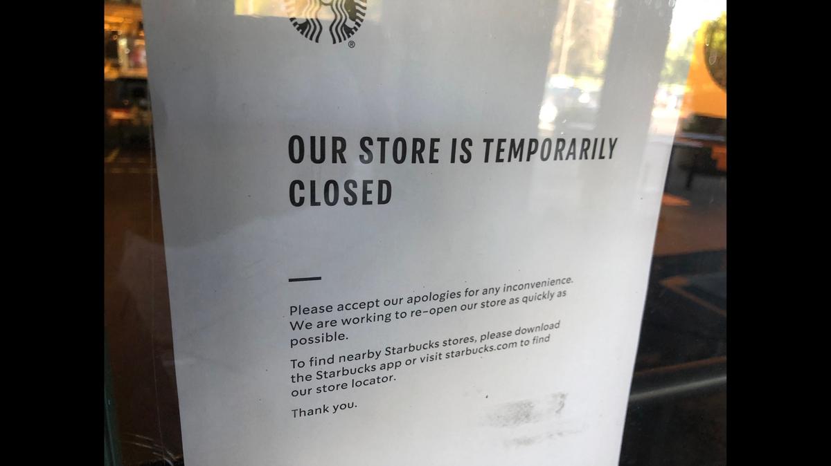 A sign announcing the Starbucks store at 2095 Gold Centre Lane in Gold River, Calif., is temporarily closed, seen Wednesday, Aug. 12, 2020. A corporate spokesperson confirmed the closure is due to an employee testing positive for the coronavirus.