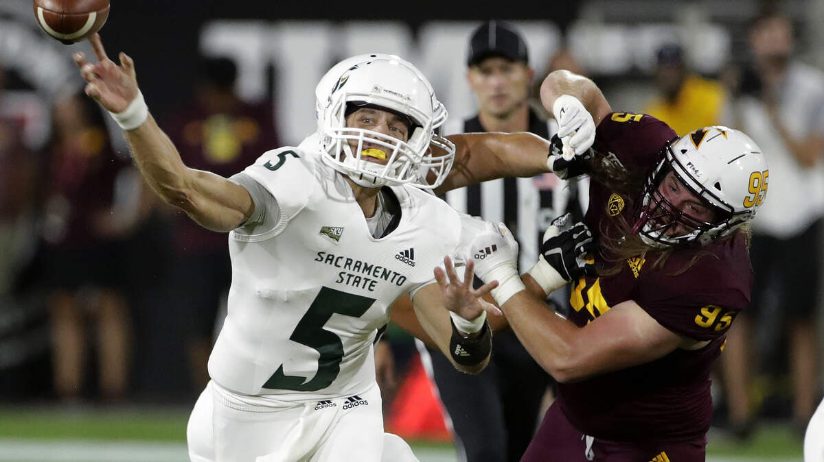 Sacramento State quarterback Kevin Thomson throws a pass against Arizona State during the Sun Devils’ 19-7 win last week.