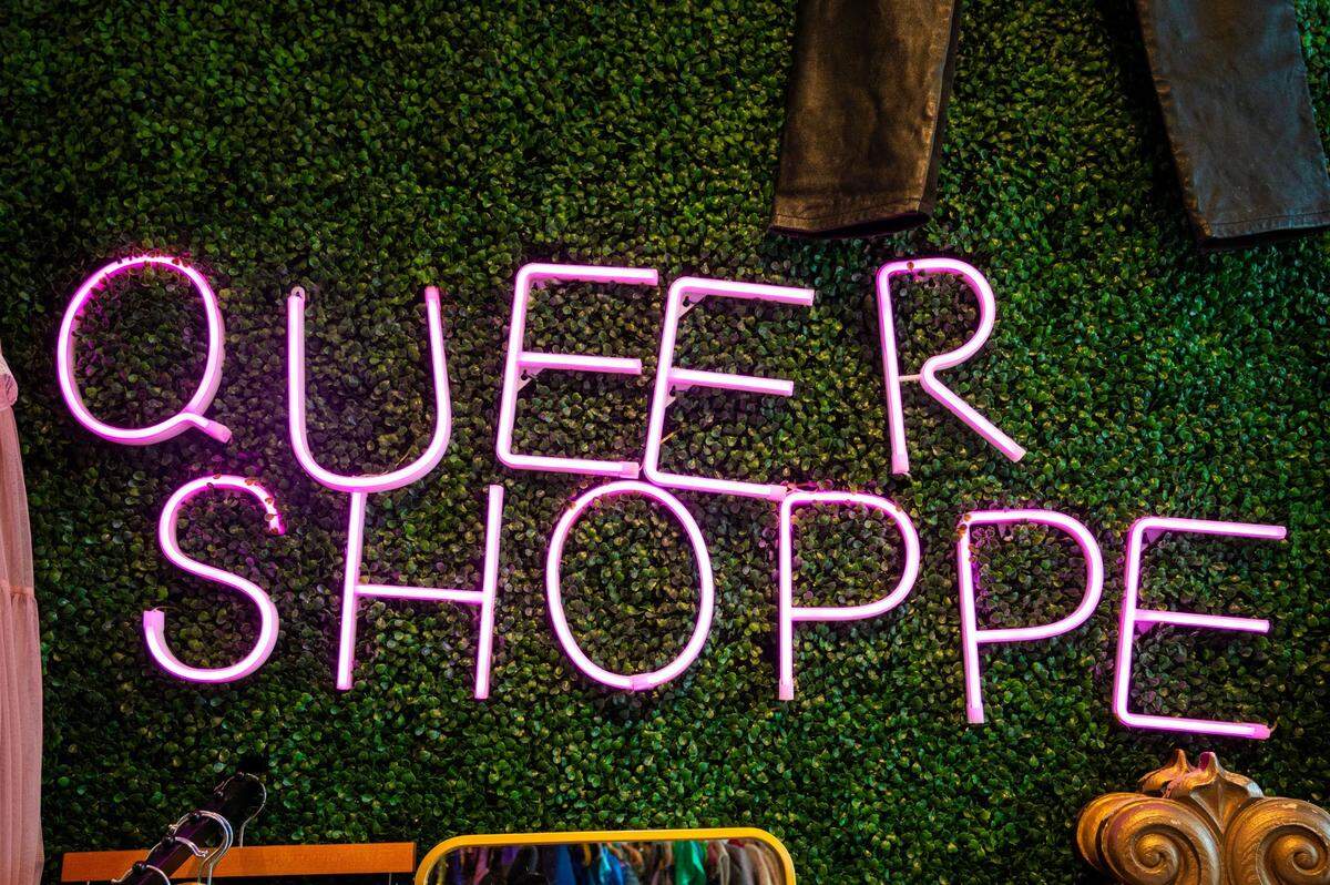 A sign inside QueerShoppe, an LGBTQ+ vintage store in Sacramento.
