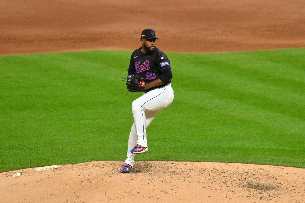 Oct 16, 2024; New York City, New York, USA; rows a pitch against the Los Angeles Dodgers New York Mets pitcher Luis Severino (40) thin the second inning during game three of the NLCS for the 2024 MLB playoffs at Citi Field. Mandatory Credit: John Jones-Imagn Images