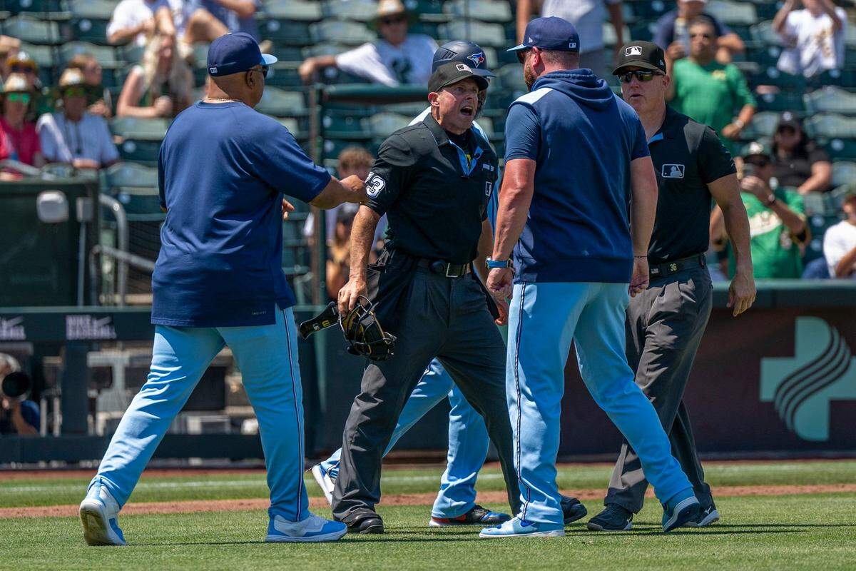 Toronto Blue Jays Manager John Schneider (14) argues with home plate umpire Tripp Gibson after being ejected in the fifth inning during a baseball game against the Athletics at Sutter Health Park in West Sacramento on Sunday.