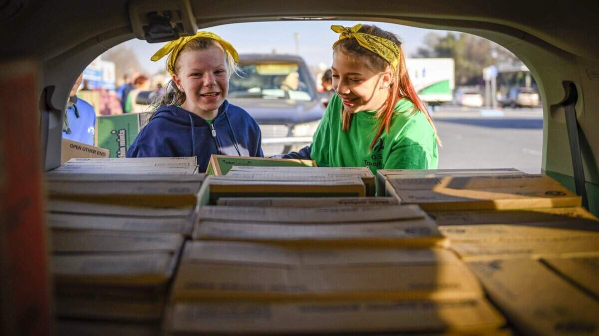Destiny Frank, 11, and Aryana Kirkland, 13, of North Highlands Girl Scout troop #333, load up a minivan with cases of Thin Mints on Saturday, Feb. 15, 2020, at the annual Girl Scout cookie mega drop, where troops from around Northern California stock up on the cookies needed to kick off their booth sales on Friday, Feb. 21. Local girl scouts picked up more than 1,082,000 packages of cookies at this event. Another mega drop with more than 222,000 packages takes place Monday in Turlock.