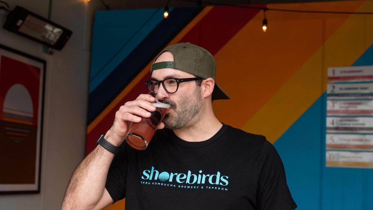 Randall Echeverria, owner at Shorebirds Brewing Co., drinks a hard kombucha in the taproom in 2022. The Rancho Cordova firm, Sacramento County’s only brewery dedicated to producing alcoholic kombucha, has closed its doors.