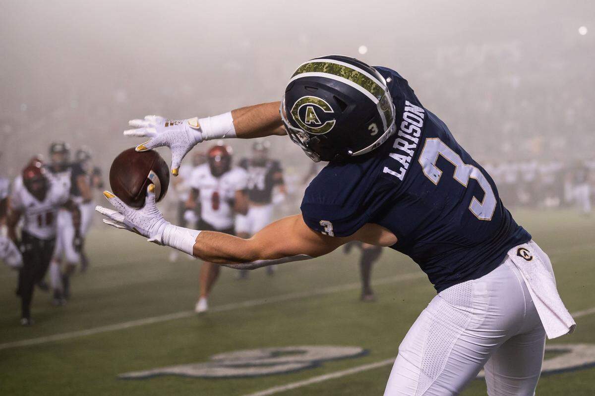 UC Davis running back Lan Larison (3) pulls in a pass just inbounds against Eastern Washington in November at UC Davis Health Stadium. The team finished 8-4 in 2021, with a first-round playoff loss at South Dakota State.