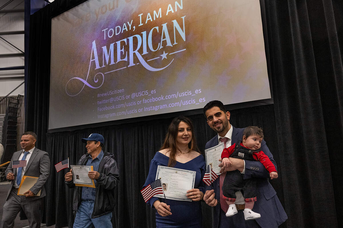 Sandra and Rimon Toma dressed their baby Lucas in red, white and blue for their U.S. Citizenship and Immigration Services naturalization ceremony in Roseville on Wednesday3. The family is originally from Iraq.