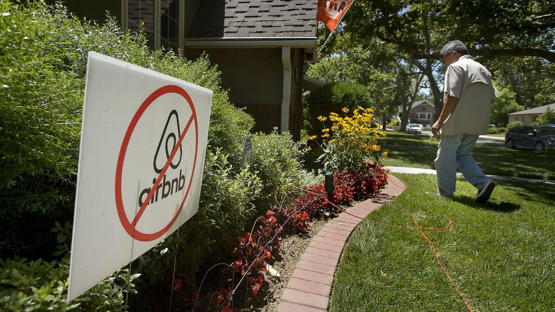 An anti-Airbnb sign is displayed in the yard of an East Sacramento home in 2018. Sacramento is considering a ban on short-term rentals in properties where the owner does not live, aiming to reduce neighborhood disturbances and boost long-term housing availability.