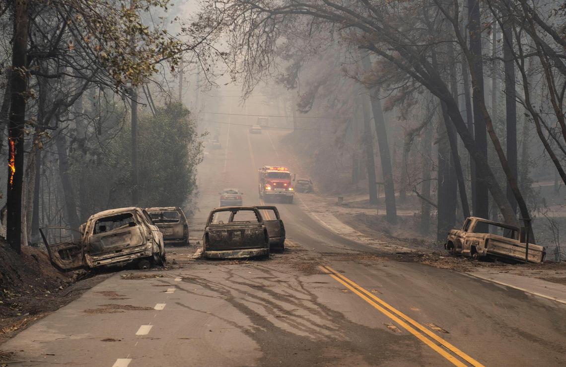 Vehicles that where burned as residents of Paradise scrambled to leave, lie stranded on Pearson Rd. in Paradise as the Camp Fire grew at a fast rate on Thursday, Nov. 8, 2018.
