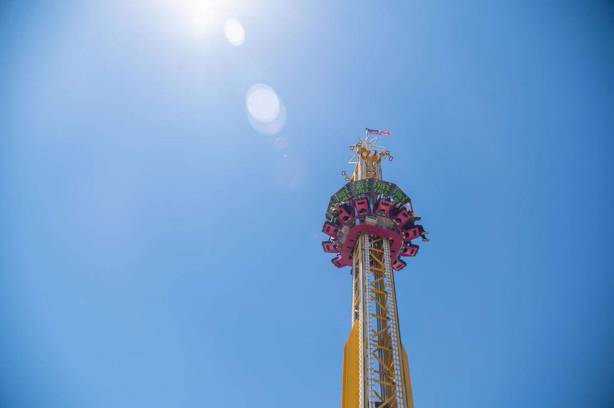 The Free Fall lifts riders into the air at the California State Fair on Tuesday. After sitting high above the fair for a few moments, the Free Fall dropped quickly before slowing to a halt at the bottom of the tower.