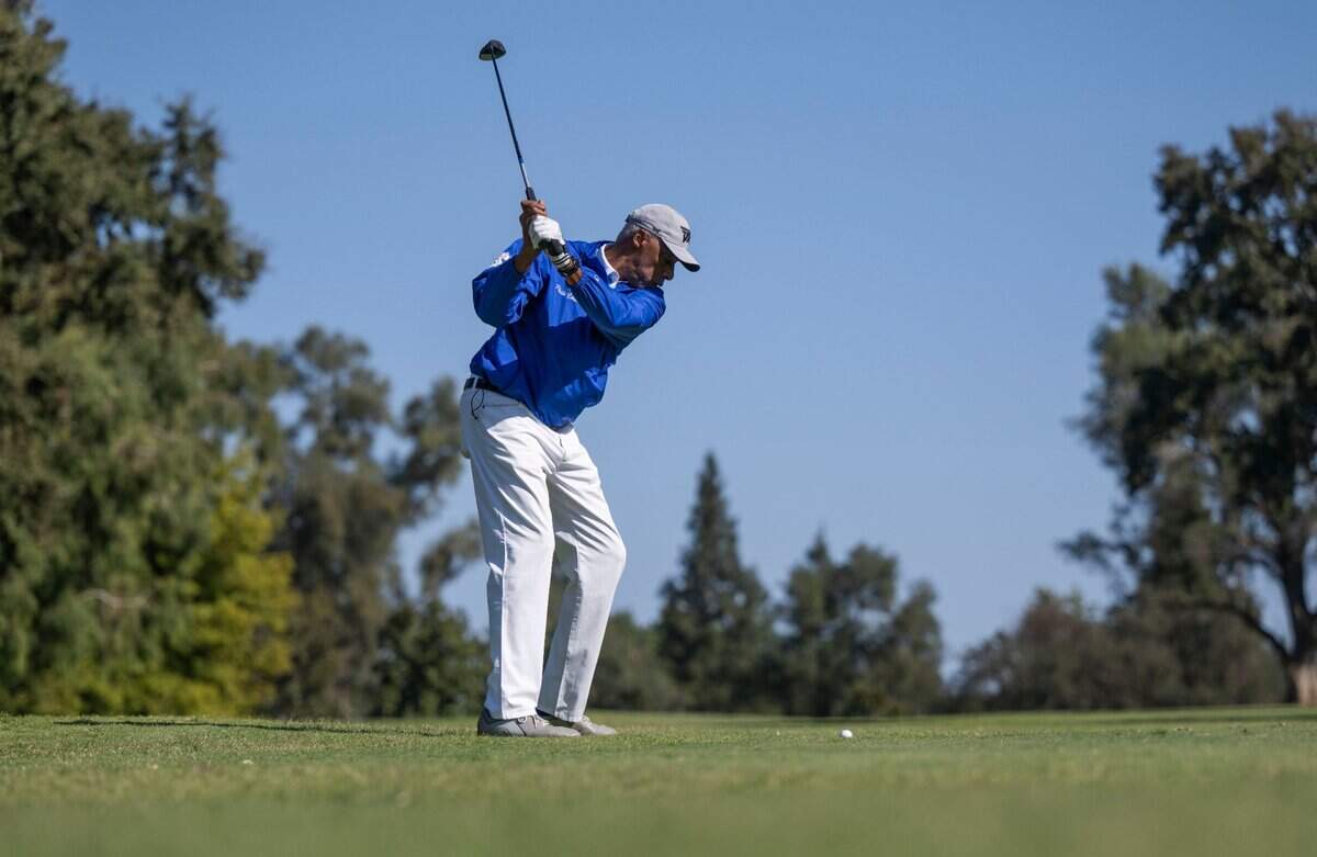 NBA legend Julius “Dr. J” Erving takes a swing in the Phil Oates Celebrity Golf Classic on Monday.